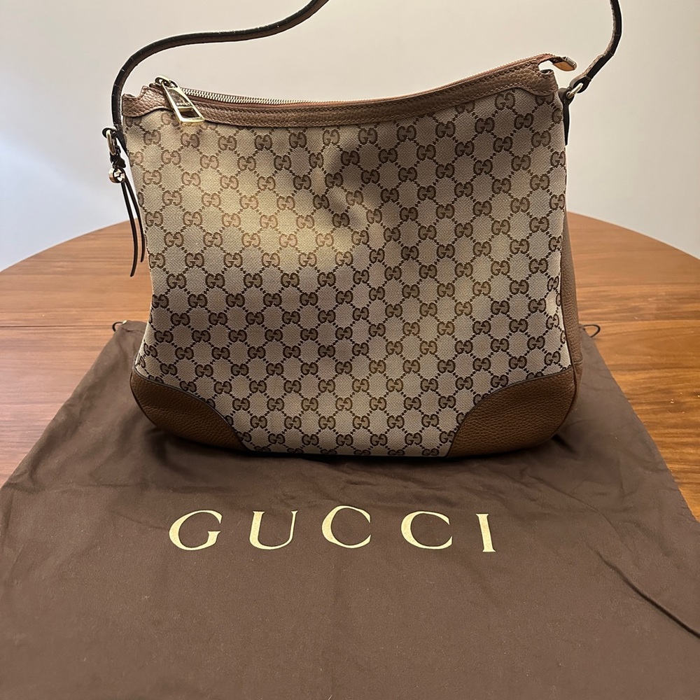 Gucci signature hobo bag leather bottom and handle. Original dust bag included.